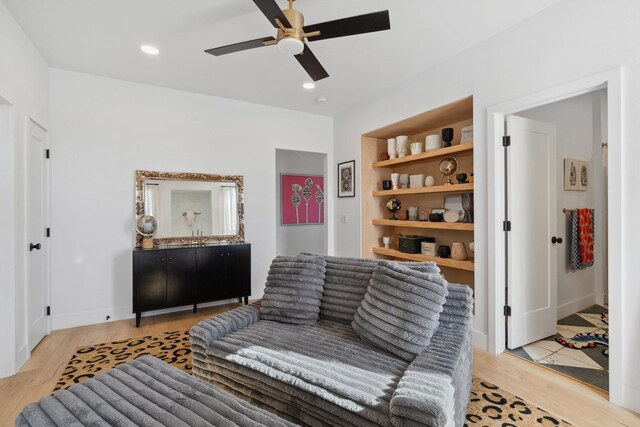 sitting room with recessed lighting, baseboards, light wood-type flooring, and a ceiling fan