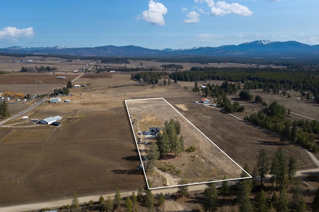 aerial view featuring a mountain view and a rural view