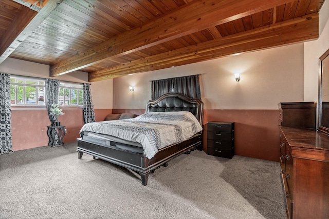 carpeted bedroom with wooden ceiling and beamed ceiling