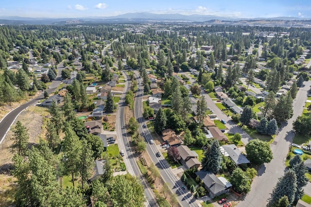 birds eye view of property with a mountain view and a residential view