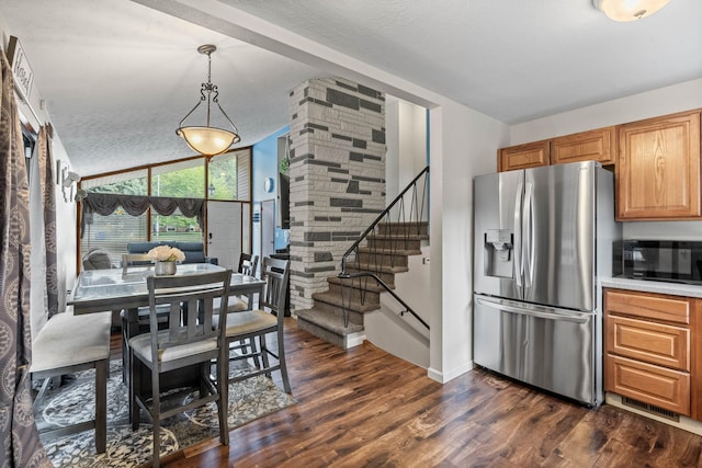 interior space featuring baseboards, stairs, vaulted ceiling, a textured ceiling, and dark wood-style flooring