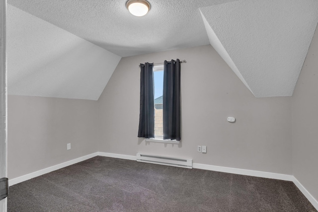 bonus room with baseboards, lofted ceiling, a textured ceiling, a baseboard heating unit, and dark carpet