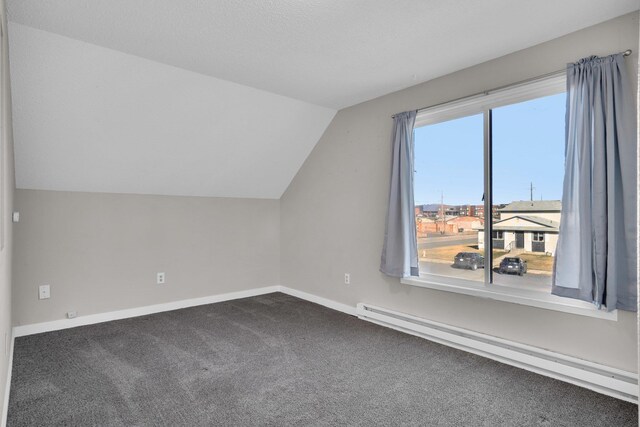 2523 N Nevada St, Spokane, WA 99207 - bonus room with baseboards, carpet flooring, a baseboard heating unit, and vaulted ceiling