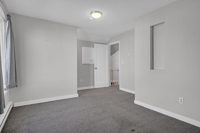 2523 N Nevada St, Spokane, WA 99207 - carpeted spare room featuring baseboards and baseboard heating