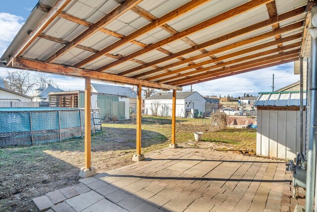2523 N Nevada St, Spokane, WA 99207 - view of patio with a storage shed, a fenced in pool, and a fenced backyard