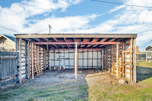 view of outdoor structure featuring fence