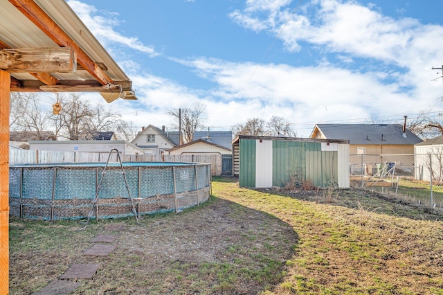 2523 N Nevada St, Spokane, WA 99207 - view of yard featuring a storage unit, fence, an outbuilding, and a fenced in pool