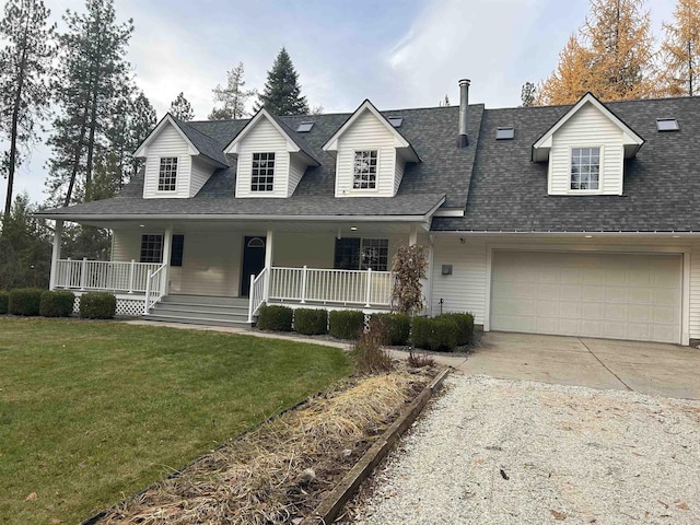 view of front of house featuring a shingled roof, concrete driveway, covered porch, and a front lawn