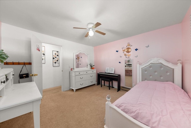 bedroom featuring light colored carpet and ceiling fan