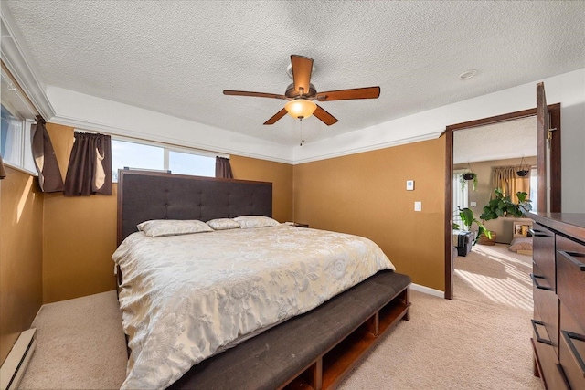 bedroom featuring light carpet, a textured ceiling, baseboards, baseboard heating, and ceiling fan