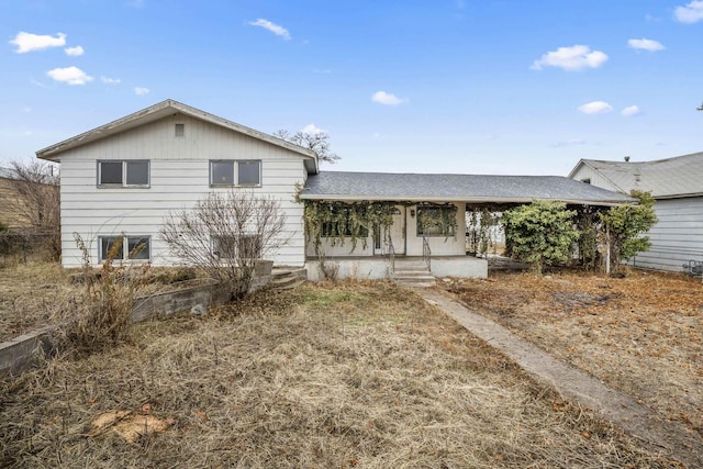 view of front of home featuring roof with shingles