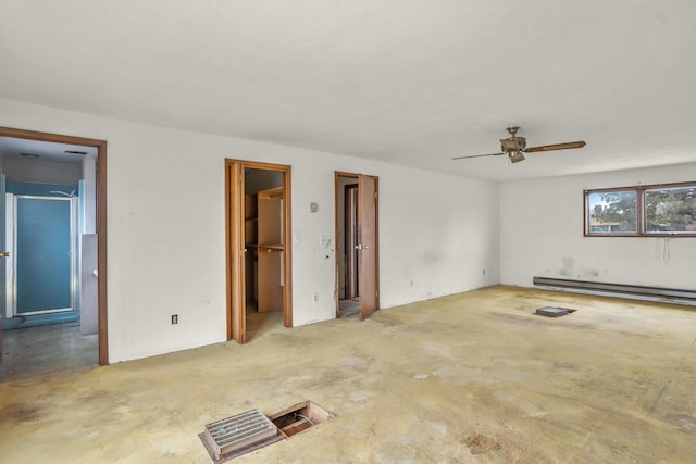 unfurnished room featuring unfinished concrete flooring, ceiling fan, and a baseboard radiator