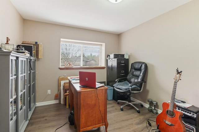 office area featuring baseboards and wood finished floors