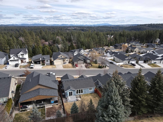 birds eye view of property with a residential view and a view of trees