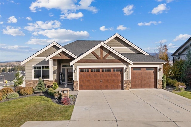 craftsman-style house with concrete driveway, a garage, stone siding, and a front lawn