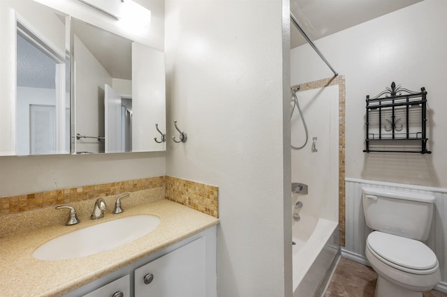 bathroom featuring shower / bathing tub combination, toilet, and vanity