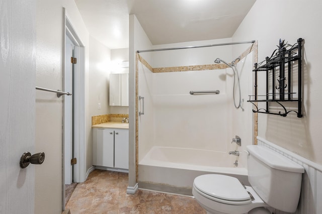 bathroom with toilet, vanity, and bathing tub / shower combination