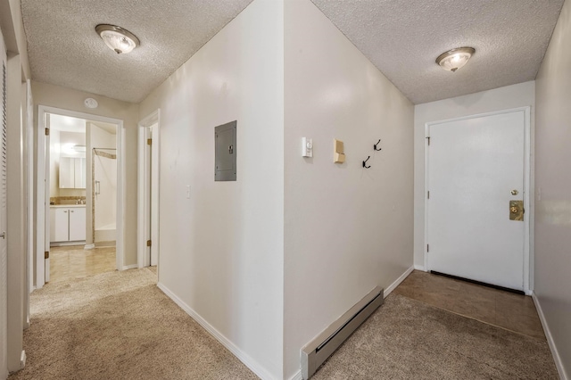 hall featuring electric panel, a baseboard heating unit, a textured ceiling, carpet, and baseboards