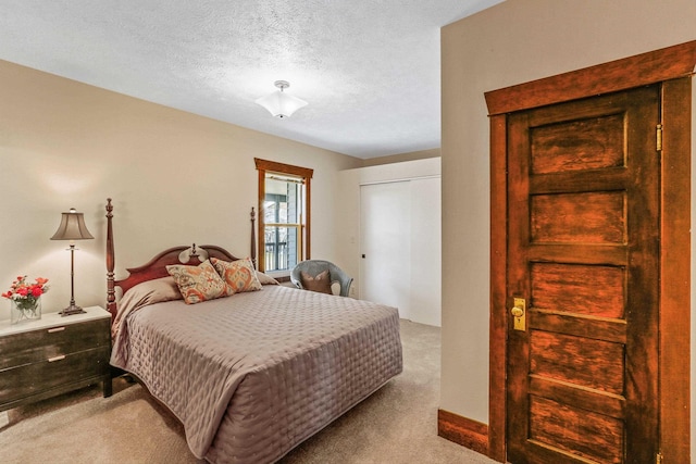 carpeted bedroom with a textured ceiling