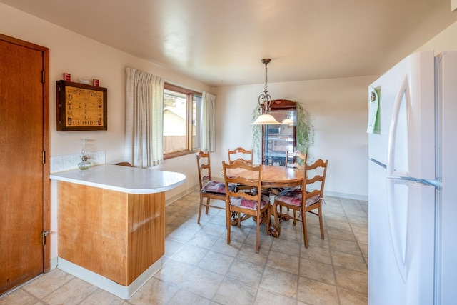 dining space with baseboards