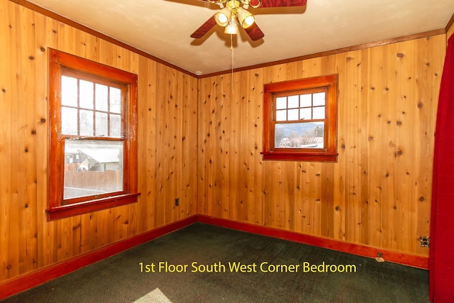 460 E Columbia Ave, Colville, WA 99114 - carpeted empty room featuring ceiling fan, baseboards, wooden walls, and crown molding