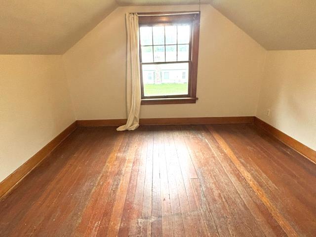 460 E Columbia Ave, Colville, WA 99114 - additional living space featuring hardwood / wood-style flooring, baseboards, and lofted ceiling