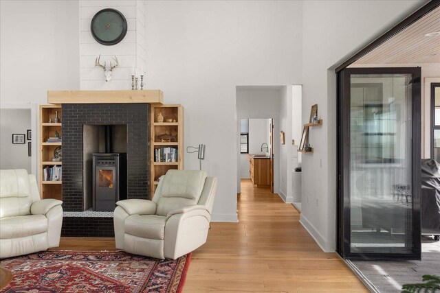 living area with baseboards and light wood-style floors