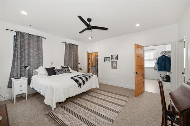 bedroom with recessed lighting, baseboards, light carpet, and a ceiling fan