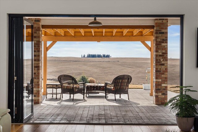 view of patio / terrace with a rural view