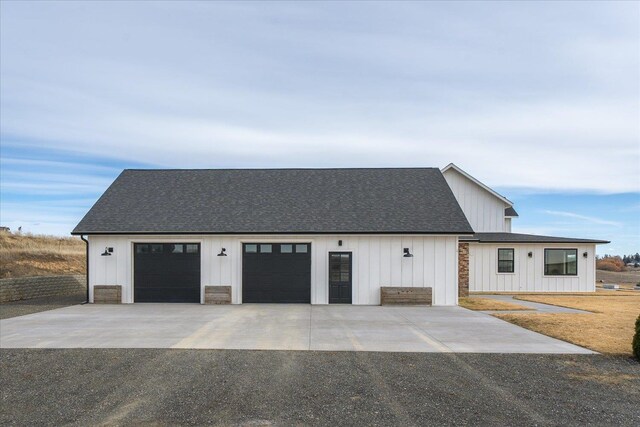 view of front of property with board and batten siding and a shingled roof