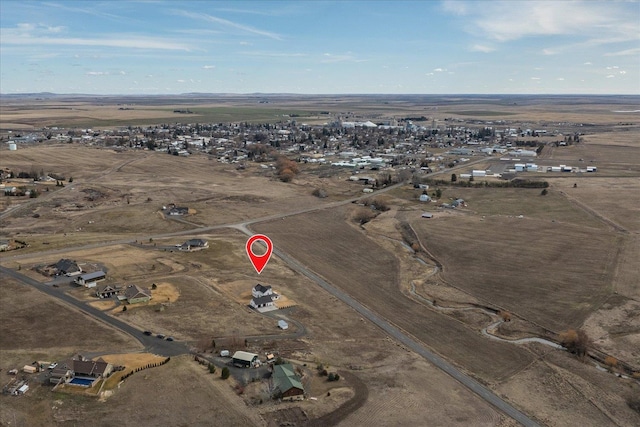 birds eye view of property featuring a rural view