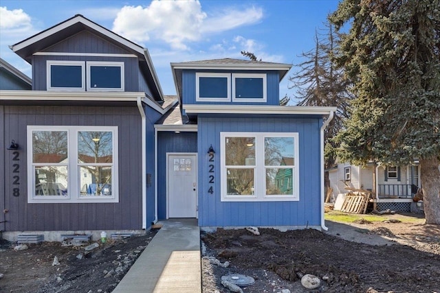 view of front of home featuring roof with shingles