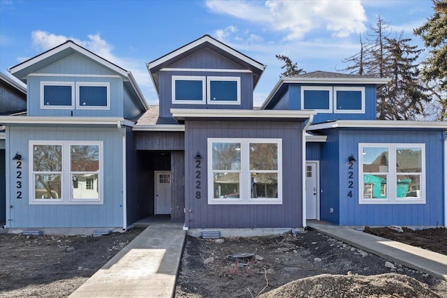 view of front of house with roof with shingles