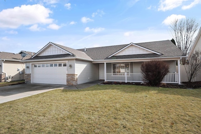 ranch-style house featuring a shingled roof, concrete driveway, a front yard, covered porch, and an attached garage