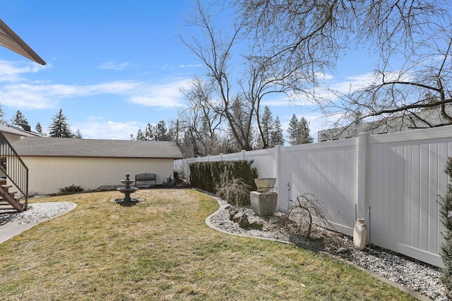 view of yard featuring a fenced backyard