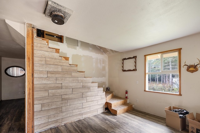 stairs with wood finished floors