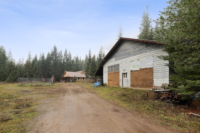 view of side of property featuring driveway