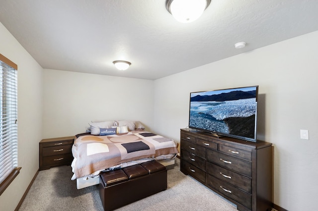 bedroom featuring light carpet