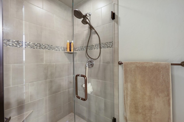 full bath with a shower stall