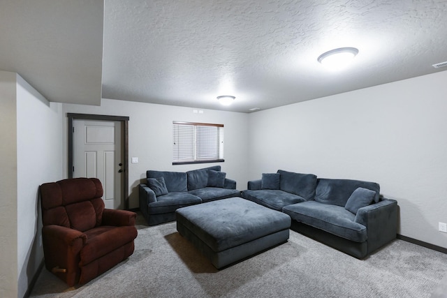 carpeted living room with a textured ceiling and baseboards