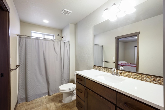 ensuite bathroom with visible vents, toilet, a shower with curtain, ensuite bath, and vanity