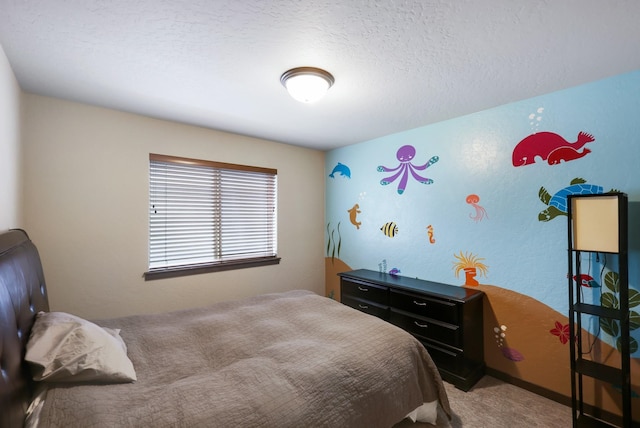 bedroom with carpet flooring and a textured ceiling