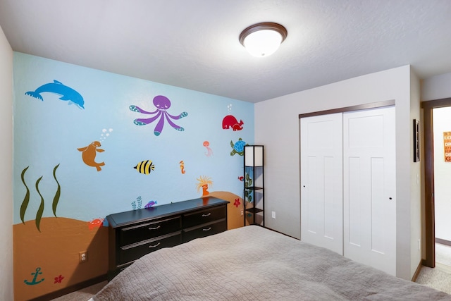 bedroom with a closet and carpet floors