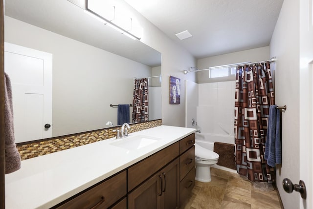 full bathroom with vanity, toilet, visible vents, and shower / tub combo with curtain