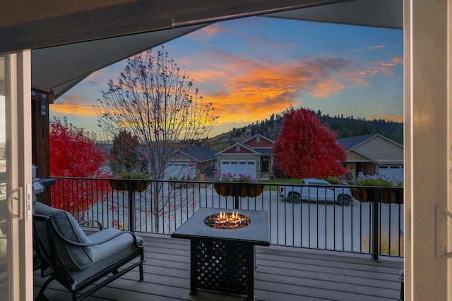 deck featuring an outdoor fire pit