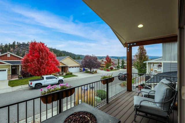 balcony featuring a mountain view and a residential view