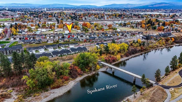 aerial view featuring a residential view and a water and mountain view