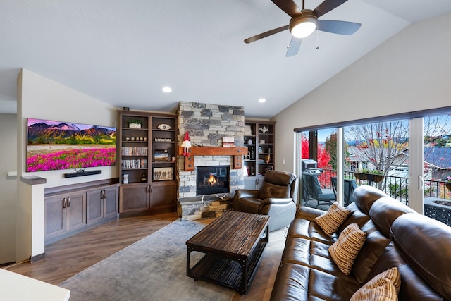 living room with vaulted ceiling, recessed lighting, a fireplace, wood finished floors, and a ceiling fan