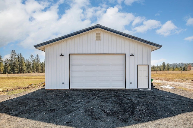 detached garage featuring driveway