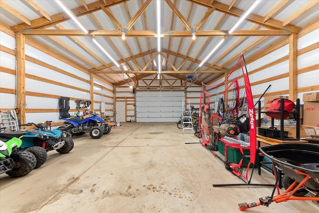 garage featuring a garage door opener and metal wall